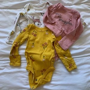 Three baby girl cloud island onesies.